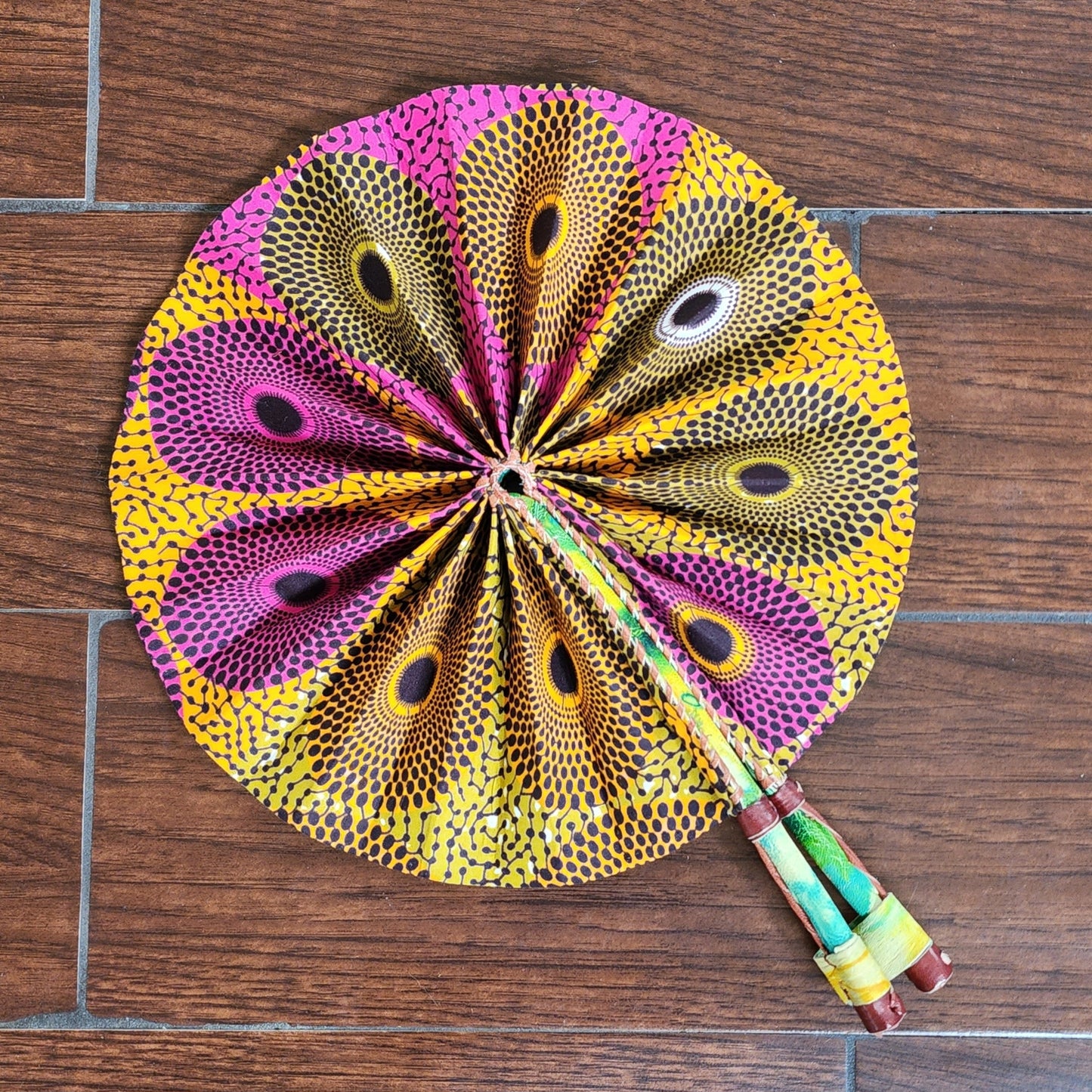 Pink and yellow Ghana hand fan