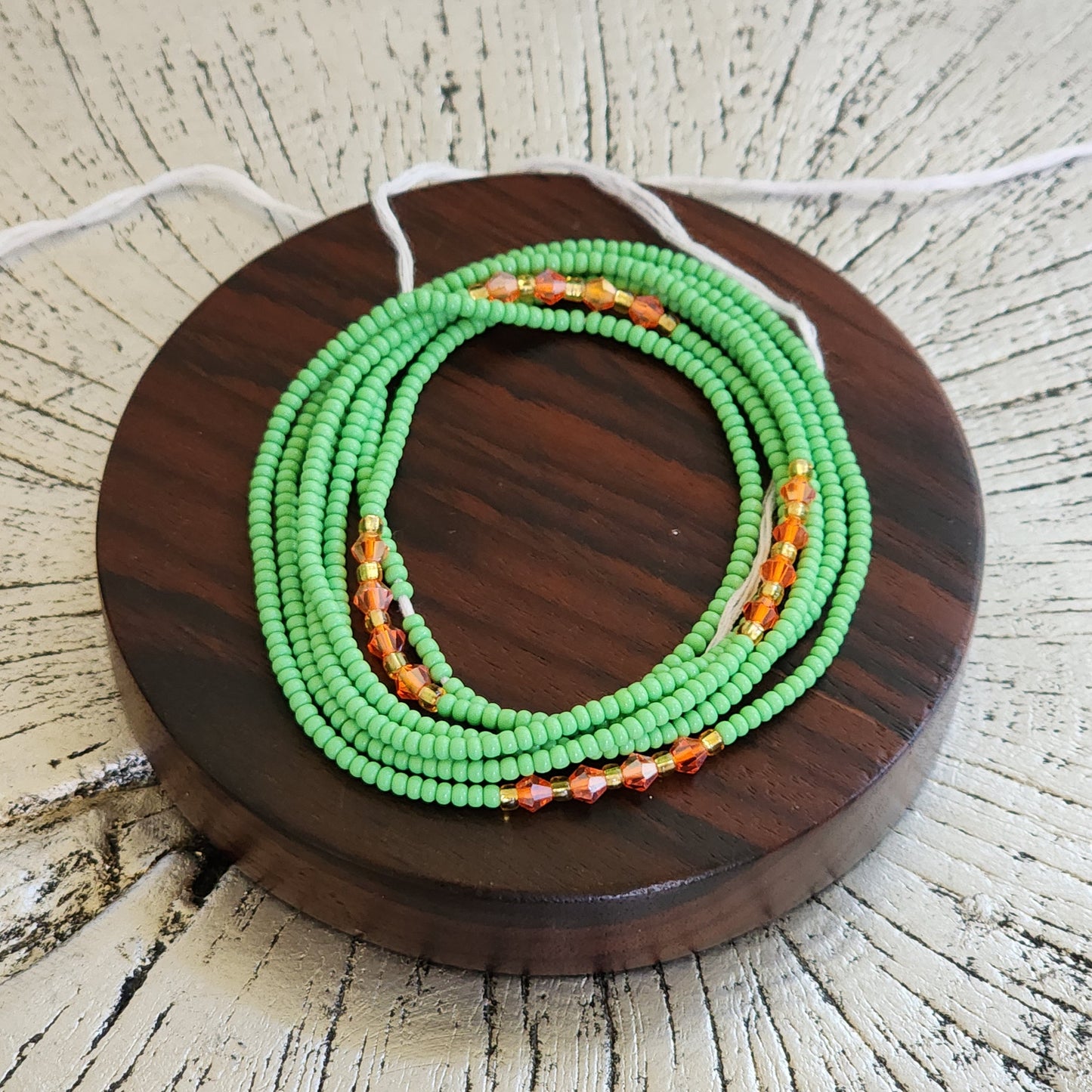 Green Premium handmade waistbeads with orange iridescent crystals