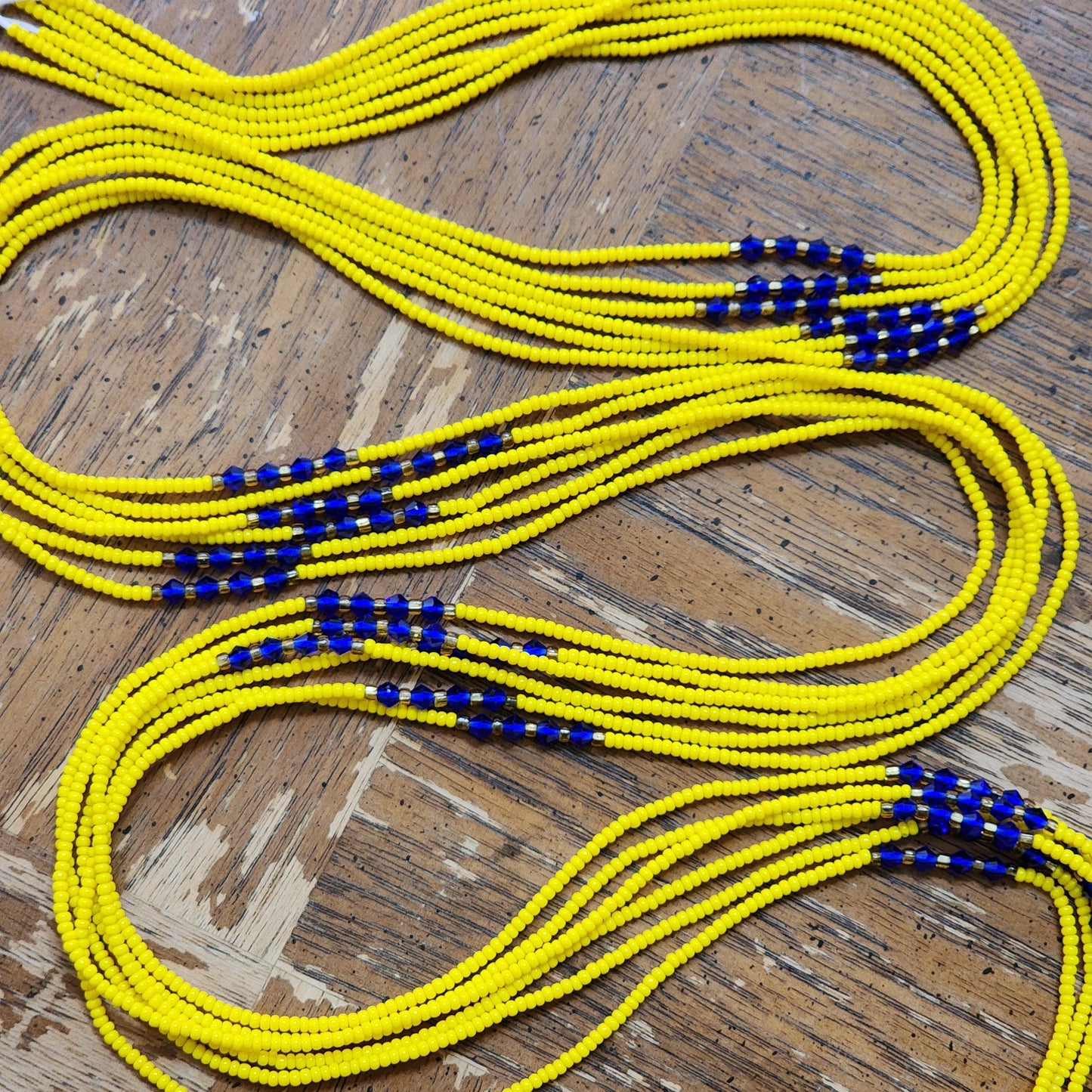 Yellow Premium handmade waistbeads with blue iridescent crystals