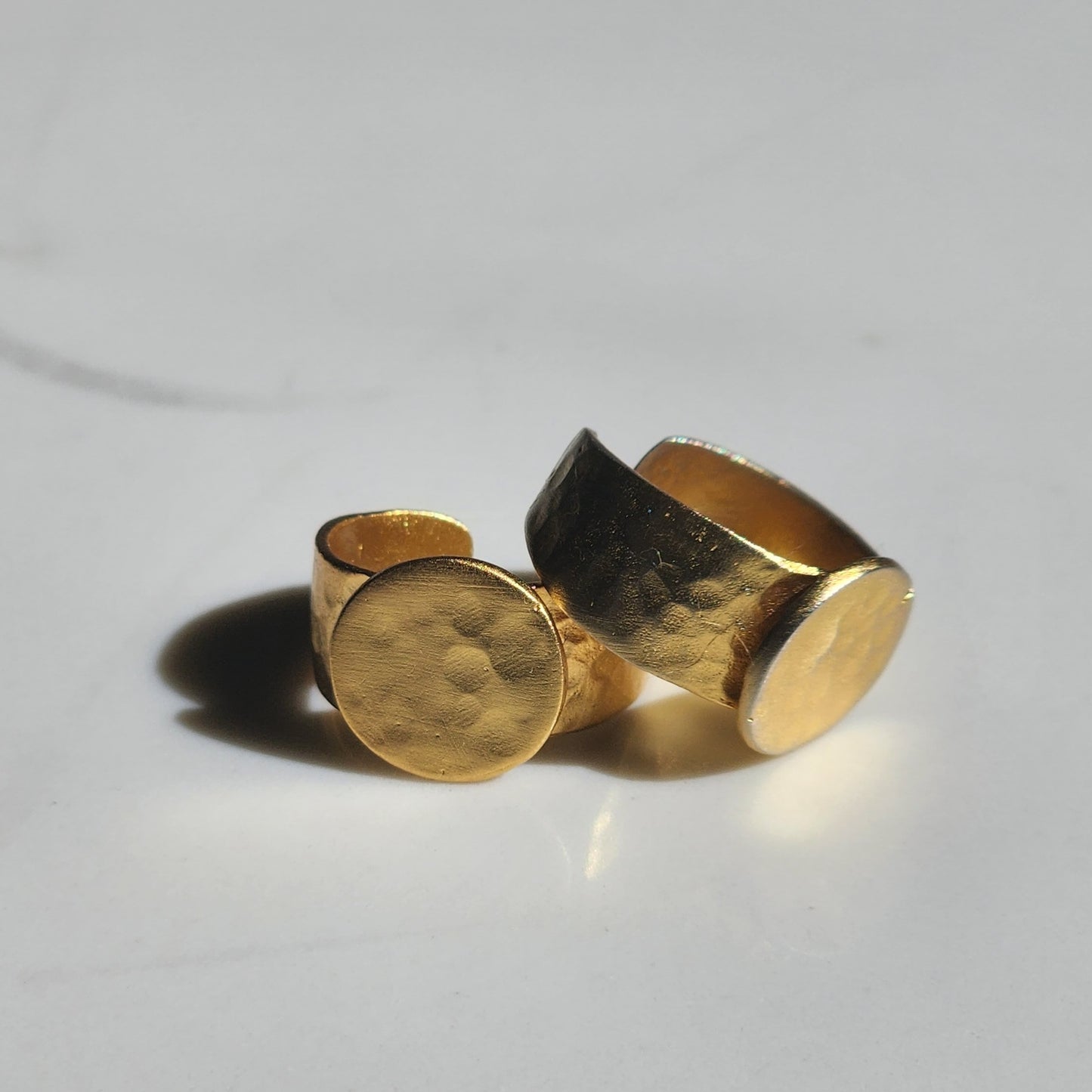 Two yellow brass, adjustable rings