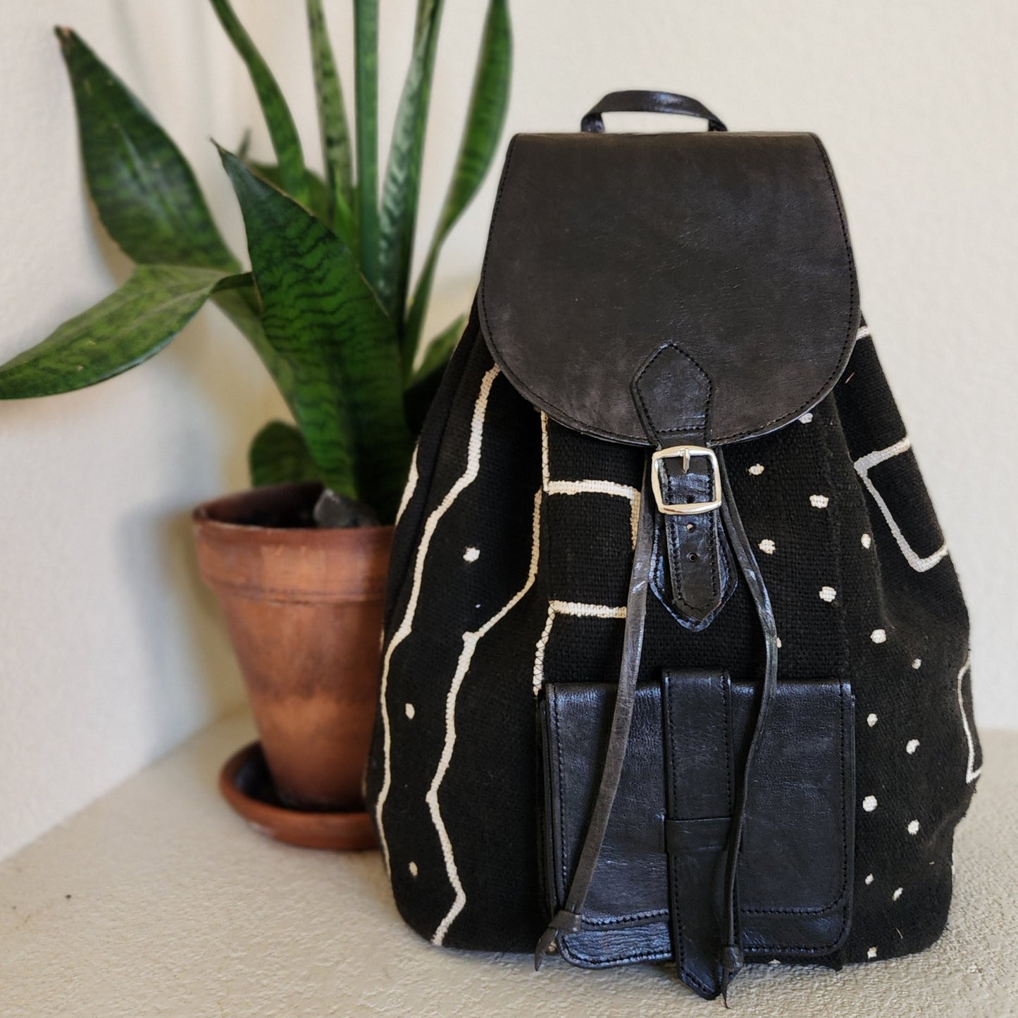 Black mudcloth backpack with black leather