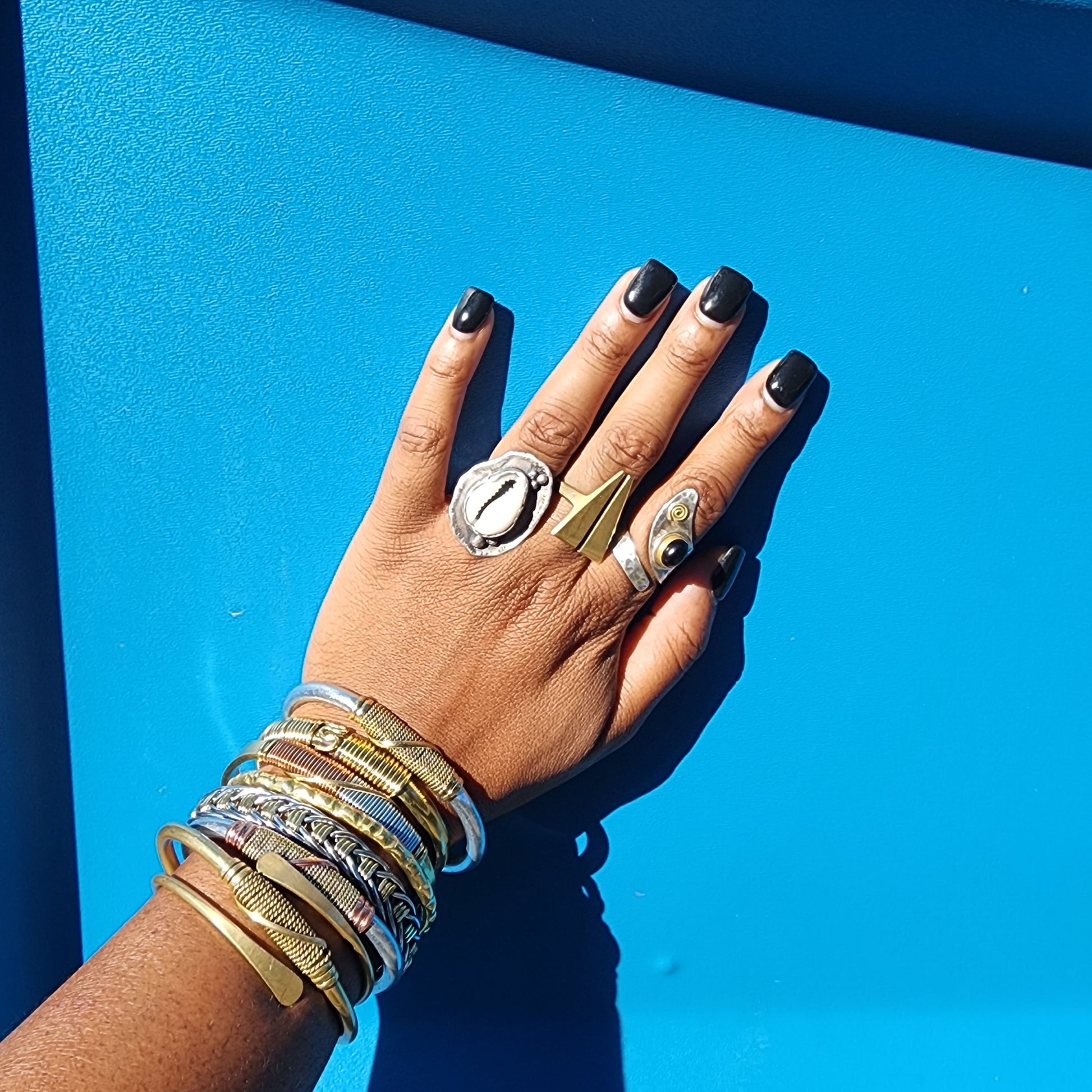 Stack of aluminum, copper and brass bracelets