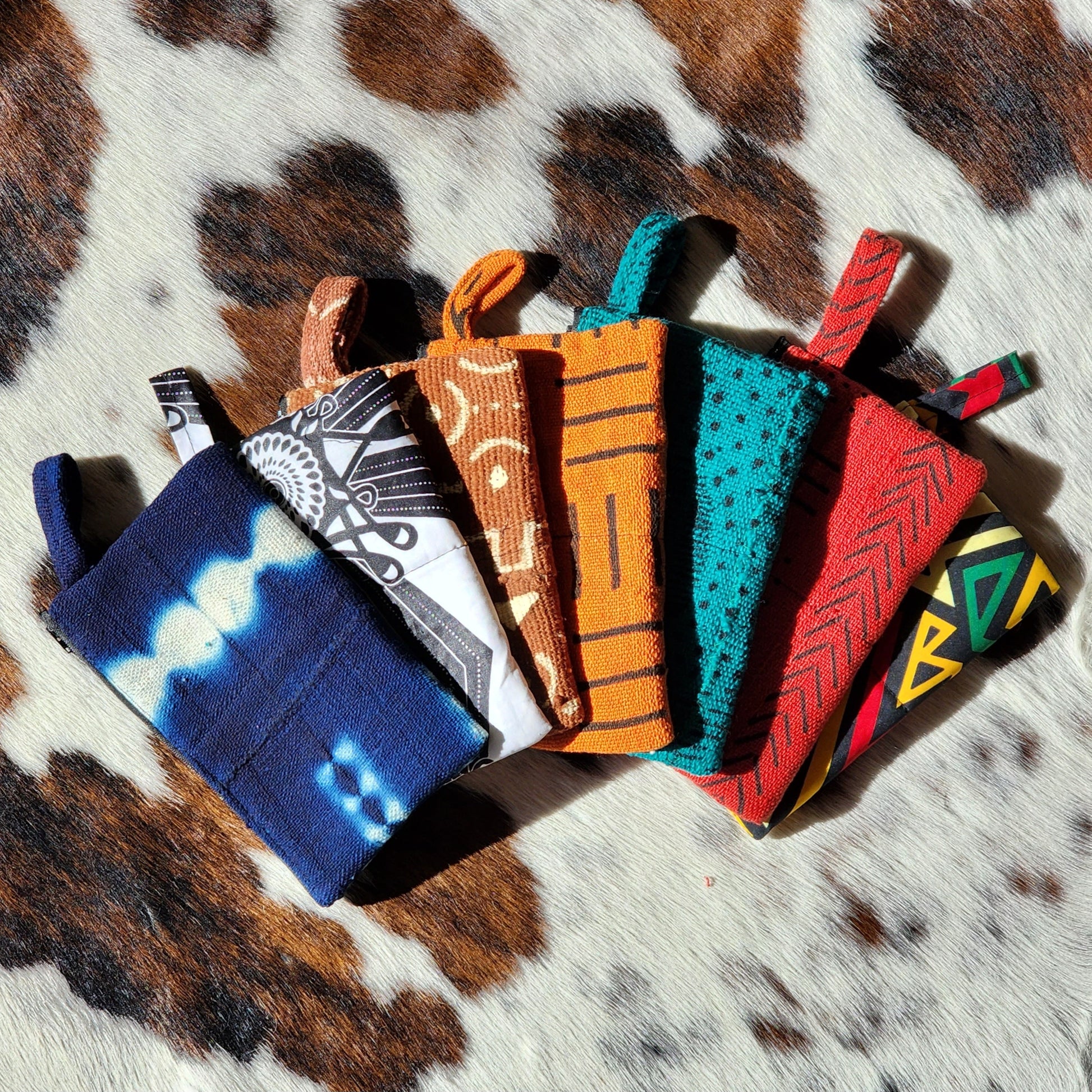 Collection of various mudcloth and ankara african print pouches