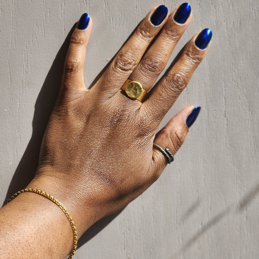 Model wearing yellow brass adjustable ring