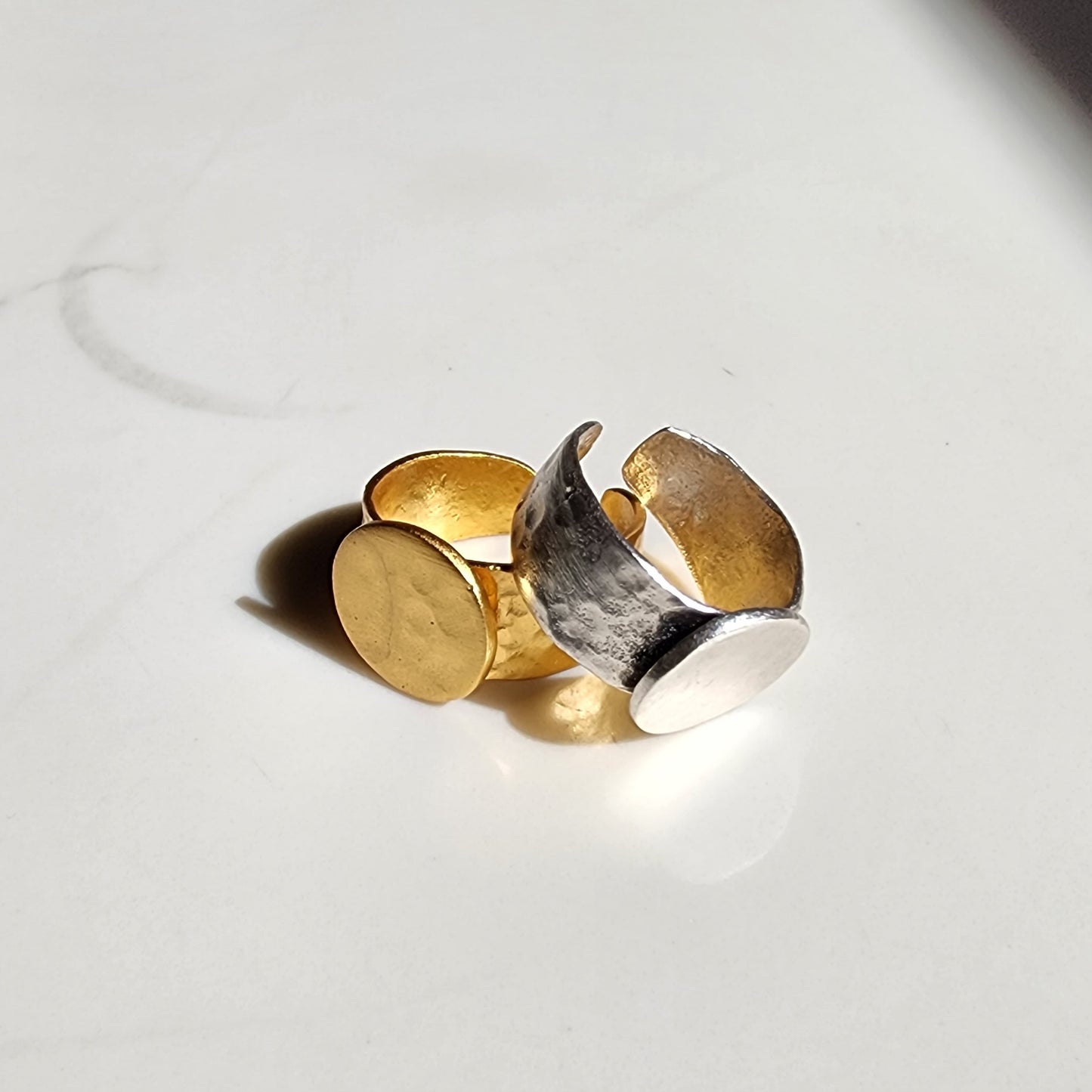 Two brass rings - yellow and silver plated 