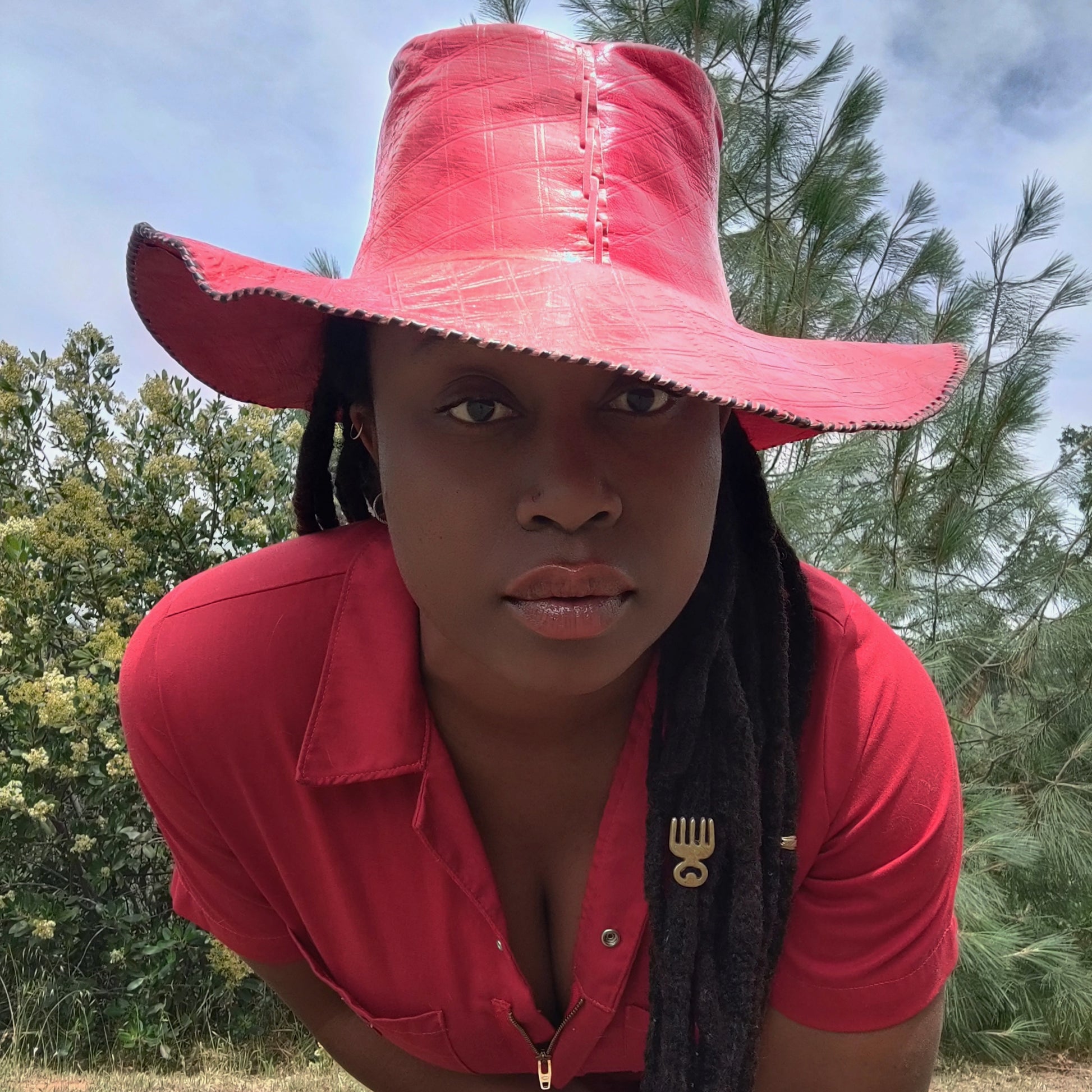 Woman in red leather hat